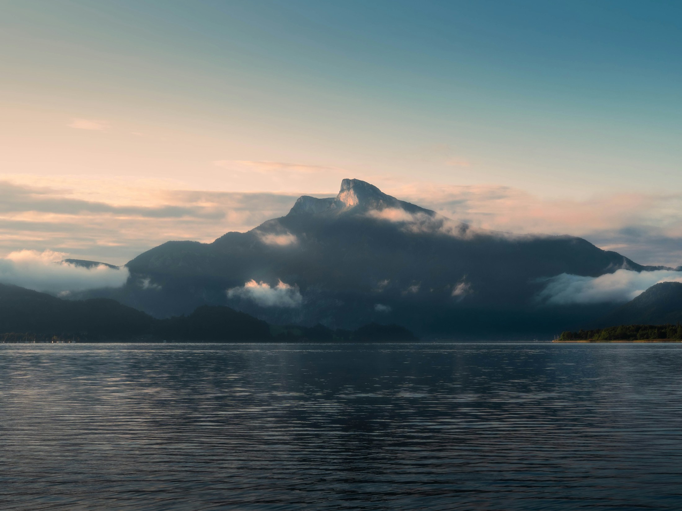 Mountains and mist above a calm lake